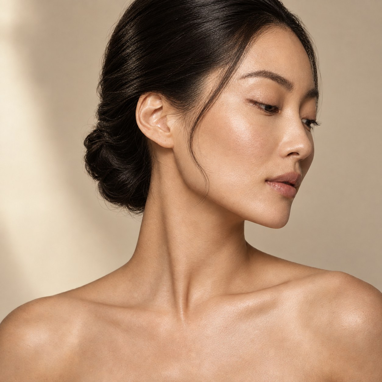 Editorial portrait of a woman with a refined, sculpted jawline